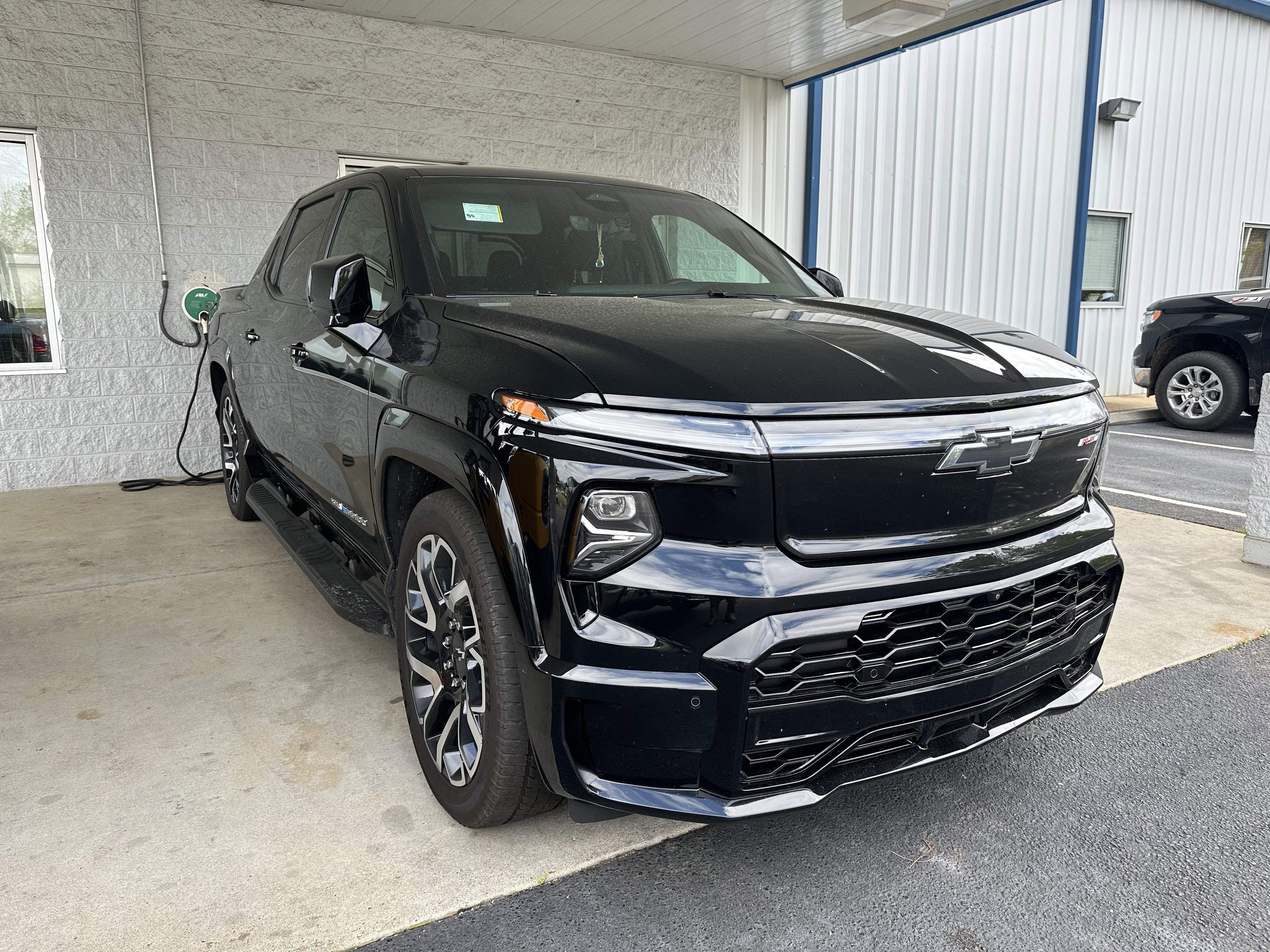 2024 Chevrolet Silverado EV RST in Black — front three-quarter view