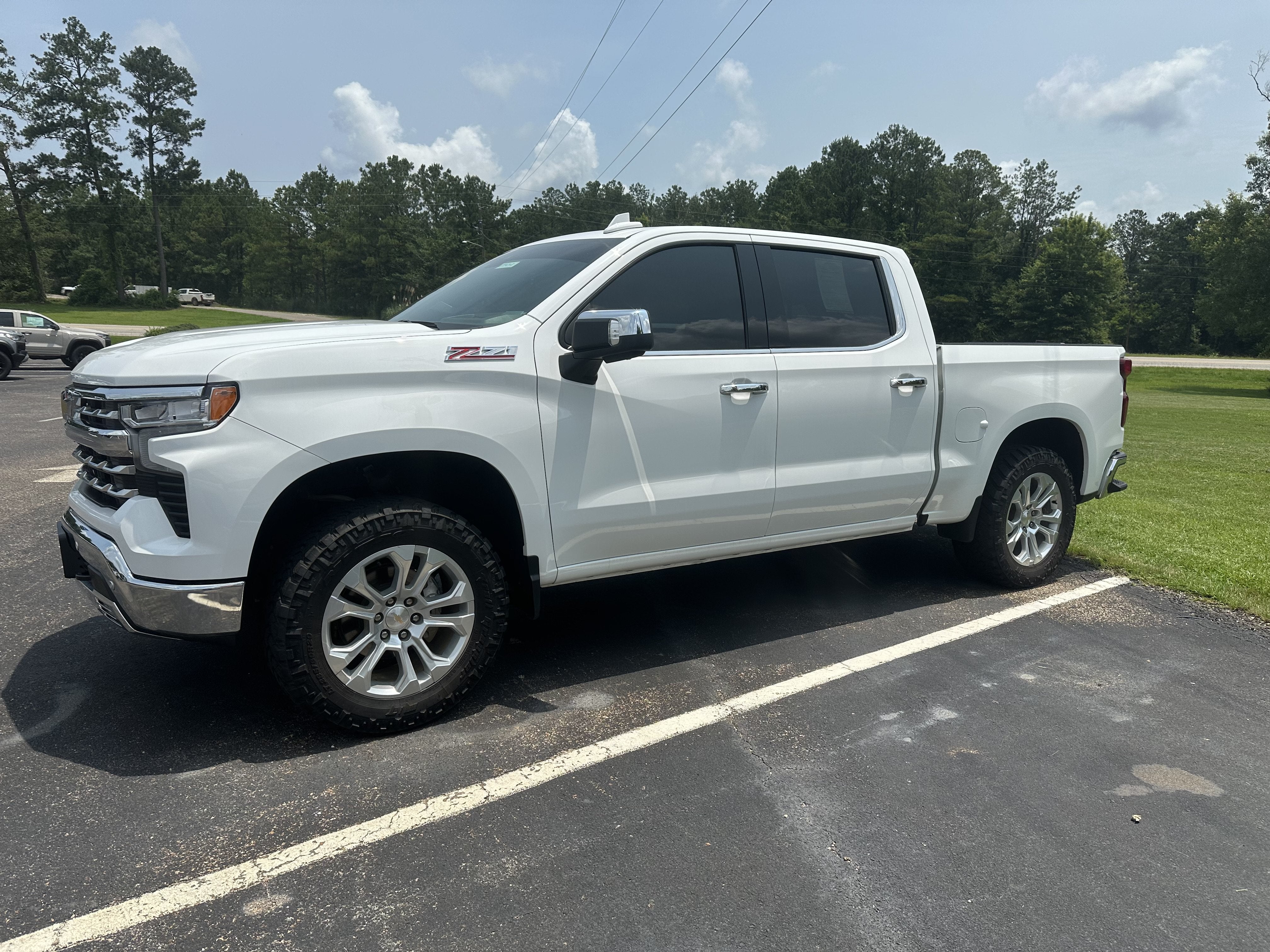 2024 Chevrolet Silverado 1500 LTZ in Summit White — front three-quarter view