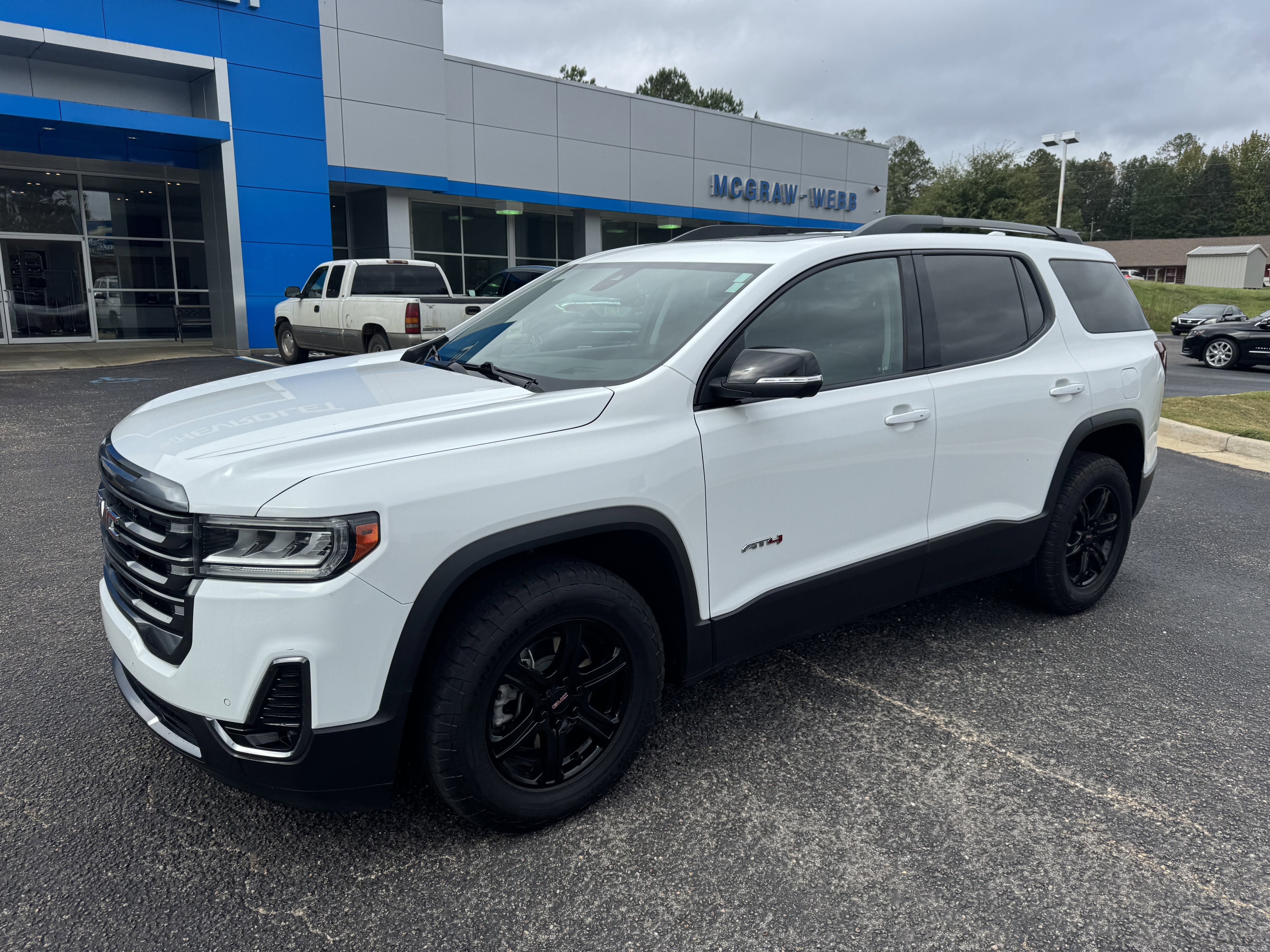 2023 GMC Acadia AT4 in Summit White — front three-quarter view